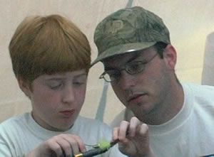 Justin Millikan looks on as another woolly bugger takes shape.